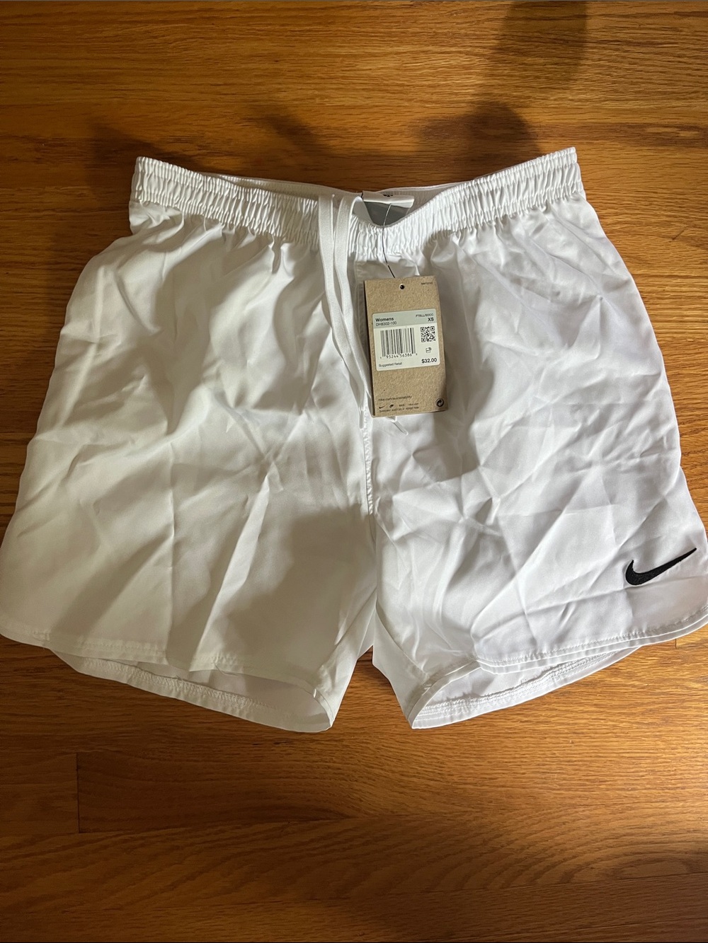 Nike White Shorts with Black Swoosh Logo
